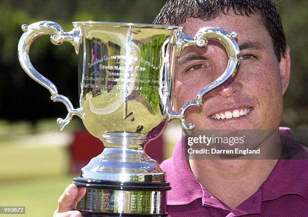 Scott Gardiner of Australia has a close look at the Stonehaven Cup at the launch of the Holden Australian Open Golf Championships which will be held...
