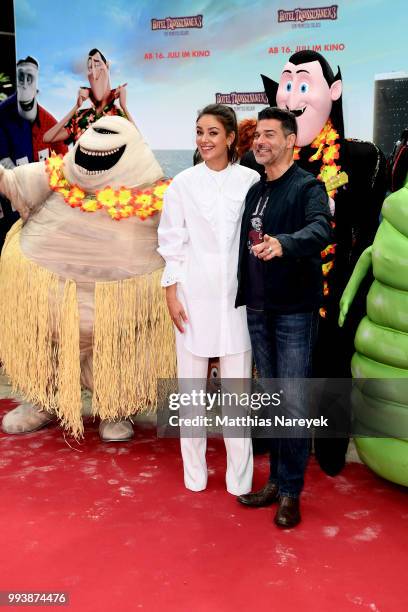 Rick Kavanian and Janina Uhse attend the 'Hotel Transsilvanien 3' premiere at CineStar on July 8, 2018 in Berlin, Germany.