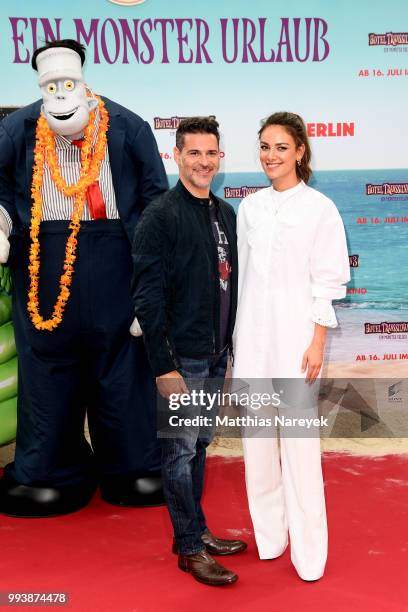 Rick Kavanian and Janina Uhse attend the 'Hotel Transsilvanien 3' premiere at CineStar on July 8, 2018 in Berlin, Germany.