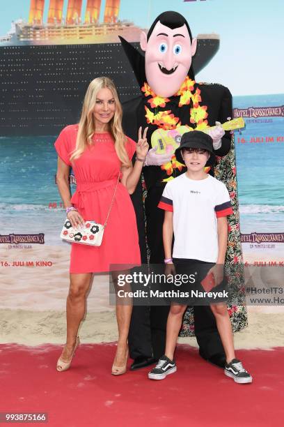 Xenia Seeberg and her son Philipp-Elias Martinek attend the 'Hotel Transsilvanien 3' premiere at CineStar on July 8, 2018 in Berlin, Germany.