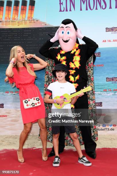 Xenia Seeberg and her son Philipp-Elias Martinek attend the 'Hotel Transsilvanien 3' premiere at CineStar on July 8, 2018 in Berlin, Germany.