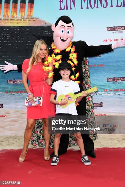 Xenia Seeberg and her son Philipp-Elias Martinek attend the 'Hotel Transsilvanien 3' premiere at CineStar on July 8, 2018 in Berlin, Germany.