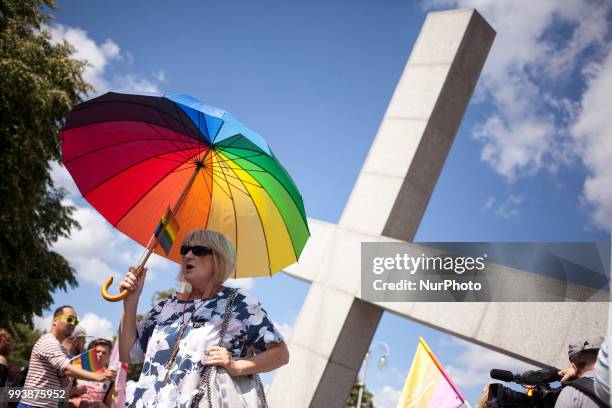 Woman holds rainbow umbrella during First Gay Parade in Czestochowa, Poland on July 8, 2018.