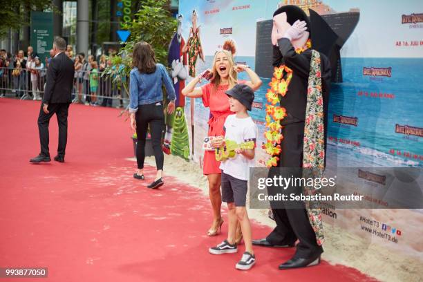 Xenia Seeberg and her son Philipp-Elias Martinek attend the 'Hotel Transsilvanien 3' premiere at CineStar on July 8, 2018 in Berlin, Germany.