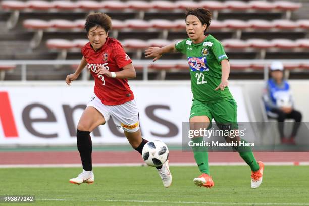 Yuika Sugasawa of Urawa Red Diamonds and Azusa Iwashimizu of NTV Beleza compete for the ball during the Nadeshiko League Cup Group A match between...