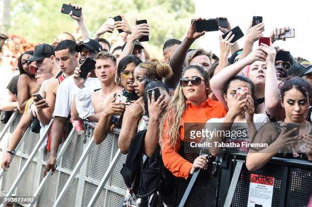 Festival goers enjoy the atmosphere in crowd of the Main Stage during Day 3 of Wireless Festival 2018 at Finsbury Park on July 8, 2018 in London,...