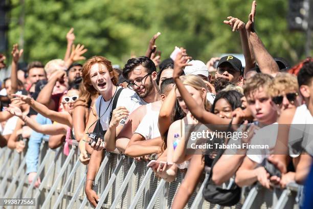Festival goers enjoy the atmosphere in crowd of the Main Stage during Day 3 of Wireless Festival 2018 at Finsbury Park on July 8, 2018 in London,...