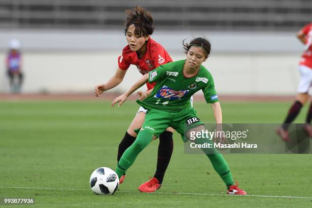 Yui Hasegawa of NTV Beleza and Aoi Kizaki of Urawa Red Diamonds compete for the ball during the Nadeshiko League Cup Group A match between Urawa Red...