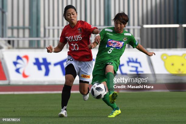 Rin Sumida of NTV Beleza and Kozue Ando of Urawa Red Diamonds compete for the ball during the Nadeshiko League Cup Group A match between Urawa Red...