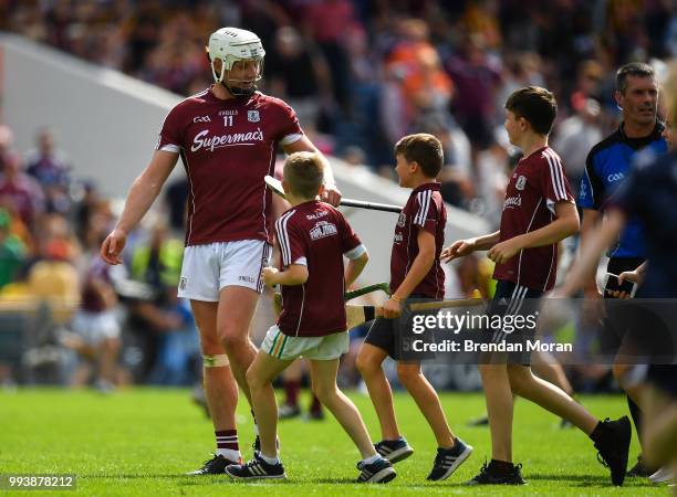 Thurles , Ireland - 8 July 2018; Joe Canning of Galway with young fans after the Leinster GAA Hurling Senior Championship Final Replay match between...