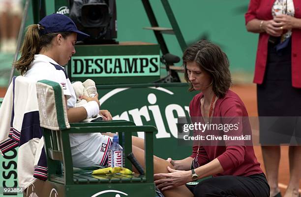 Jennifer Capriati of the USA is treated by her physio in her Semi final match against Martina Hingis of Switzerland during the French Open Tennis at...