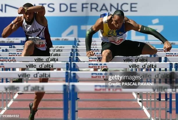 France's Pascal Martinot-Lagarde and Garfield Darien compete in the men's 110 metre hurdles final during the French Elite Athletics Championships in...