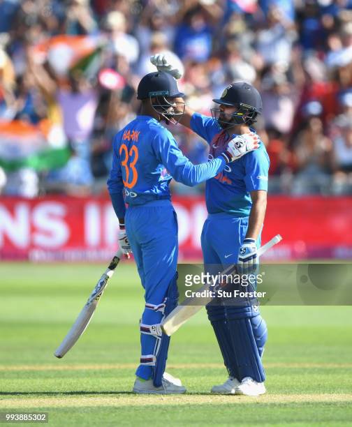 India batsman Rohit Sharma and Hardik Pandya celebrate victory during the 3rd Vitality International T20 match between England and India at The...