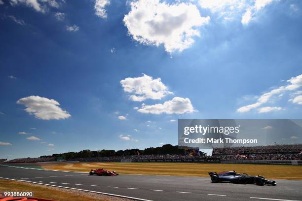 Valtteri Bottas driving the Mercedes AMG Petronas F1 Team Mercedes WO9 leads Sebastian Vettel of Germany driving the Scuderia Ferrari SF71H on track...