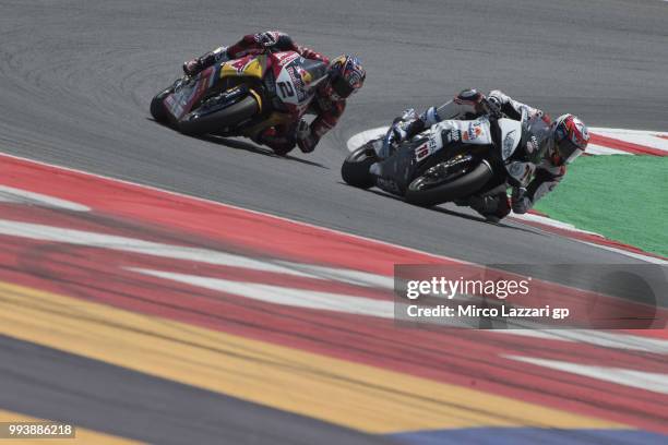 Loris Baz of France and Gulf Althea BMW Racing Team leads Leon Camier of Great Britain and Red Bull Honda World Superbike Team during the Superbike...