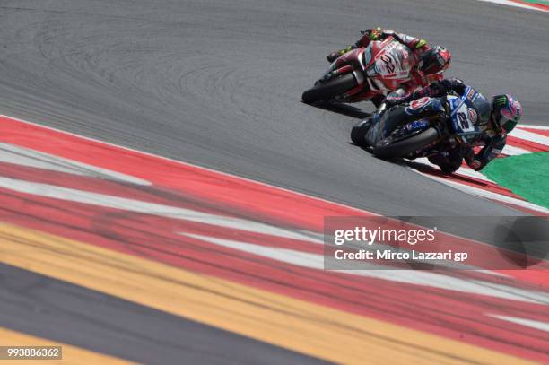 Alex Lowes of Great Britain and PATA Yamaha Official WorldSBK Team leads Lorenzo Savadori of Italy and Milwaukee Aprilia during the Superbike race 2...