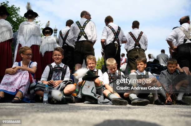 Boys in traditional Bavarian costums attend a catholic service on the occasion of the 125th anniversary of the local Gebirgstrachten-Erhaltungsverein...