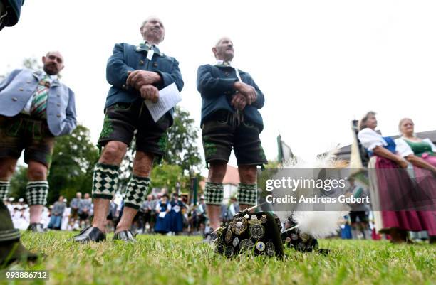 People in traditional Bavarian costums attend a catholic service on the occasion of the 125th anniversary of the local...