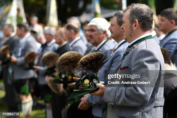 Men in traditional Bavarian costums attend a catholic service on the occasion of the 125th anniversary of the local Gebirgstrachten-Erhaltungsverein...