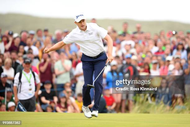 Russell Knox of Scotland celebrates holing a putt for victory on the 18th green during a playoff at the end of the final round of the Dubai Duty Free...