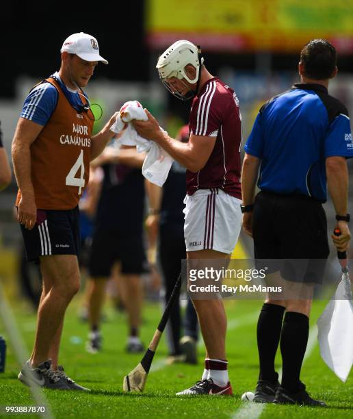 Thurles , Ireland - 8 July 2018; Joe Canning of Galway wipes his hands and arms with a towel before taking a sideline cut during the Leinster GAA...