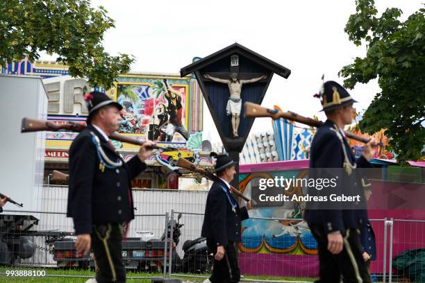 Riflemen in traditional Bavarian costums attend a parade celebrating the 125th anniversary of the local Gebirgstrachten-Erhaltungsverein Murnau on...