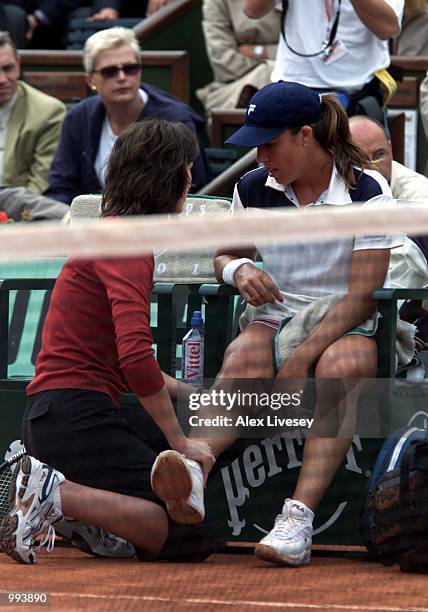 Jennifer Capriati of the USA is treated by her physio in her Semi final match against Martina Hingis of Switzerland during the French Open Tennis at...