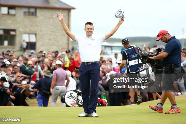 Russell Knox of Scotland celebrates his victory on the 18th green during a playoff at the end of the final round of the Dubai Duty Free Irish Open at...