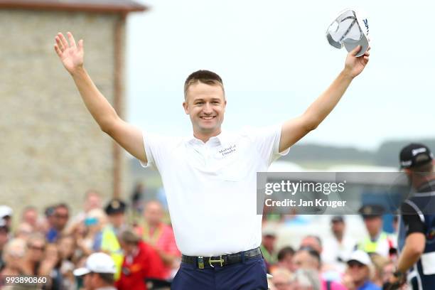 Russell Knox of Scotland celebrates his victory on the 18th green during a playoff at the end of the final round of the Dubai Duty Free Irish Open at...