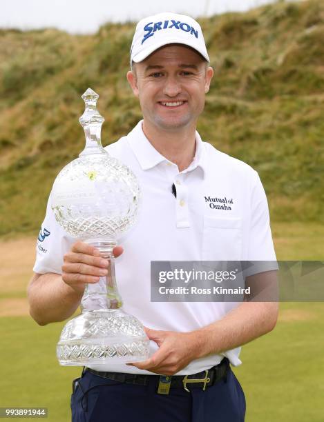 Russell Knox of Scotland with the winners trophy after his play-off win in the final round of the Dubai Duty Free Irish Open at Ballyliffin Golf Club...