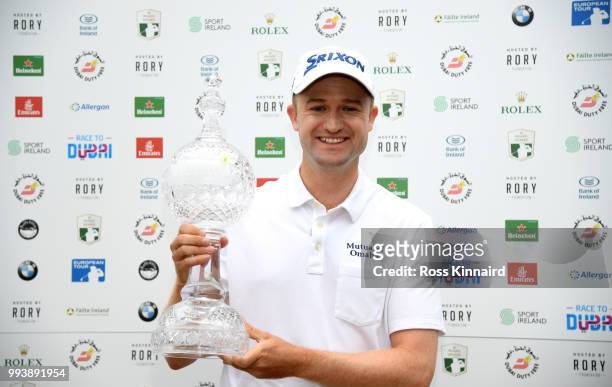 Russell Knox of Scotland with the winners trophy after his play-off win in the final round of the Dubai Duty Free Irish Open at Ballyliffin Golf Club...