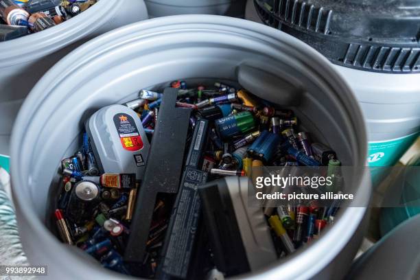 June 2018, Hanover, Germany: Batteries are in a disposal bin at a recycling center in Hanover. Whether button cell from the hearing aid or...