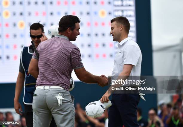 Donegal , Ireland - 8 July 2018; Russell Knox of Scotland, right, shakes hands with Ryan Fox of New Zealand after winning the play off on the 18th...