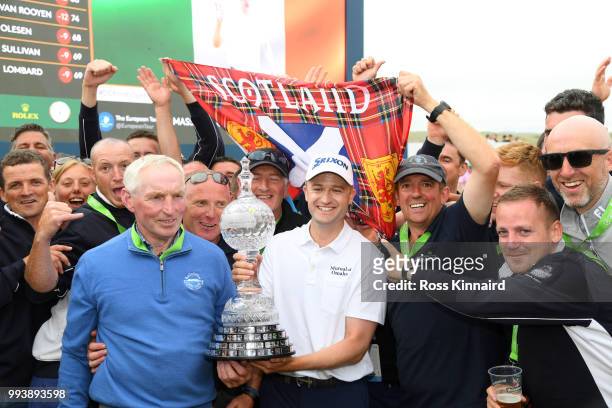 Russell Knox of Scotland celebrates with the trophy following his victory on the 18th green during a playoff at the end of the final round of the...