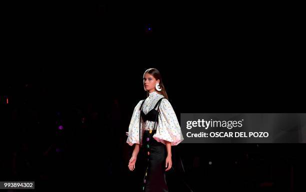 Model displays an outfit of Spanish designer Maria Escote Spring/Summer 2019 collection during the Madrid's Mercedes Benz Fashion Week on July 08,...