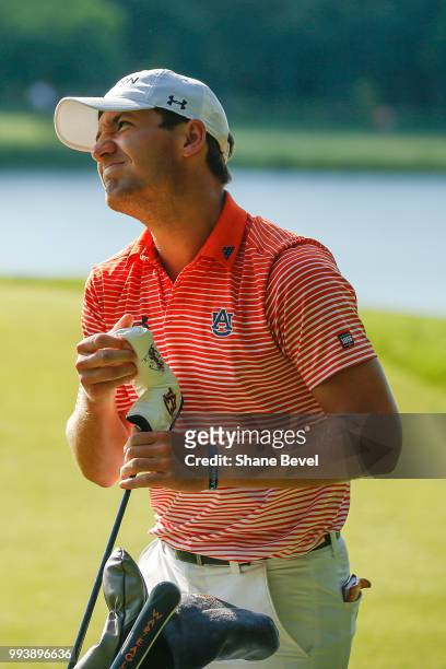 Brandon Mancheno of Auburn reacts to a bad chip on the 18th green during the Division I Men's Golf Individual Stroke Play Championship held at the...