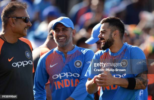 Virat Kohli, MS Dhoni and Ravi Shastri of India laugh after the 3rd Vitality International T20 between England and India on July 8, 2018 in Bristol,...