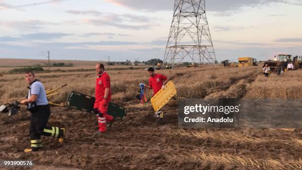 Rescue team workers are dispatched to the scene after several bogies of a passenger train derailed at the Sarilar village of Tekirdags Corlu district...