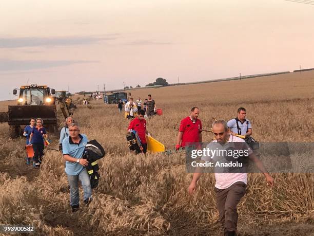 Rescue team workers are dispatched to the scene after several bogies of a passenger train derailed at the Sarilar village of Tekirdags Corlu district...