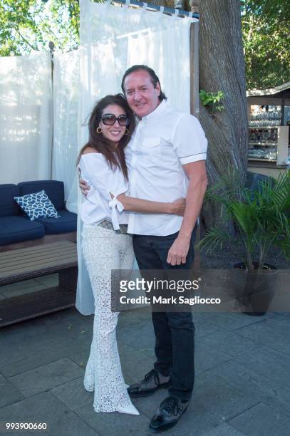 Karen Frankel and Larry Scott attend the Hamptons Magazine Cover Star Rose Byrne Celebration Presented By Lalique Along With Maddox Gallery at...