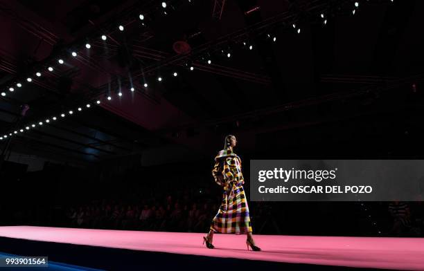 Model displays an outfit of Spanish designer Maria Escote Spring/Summer 2019 collection during the Madrid's Mercedes Benz Fashion Week on July 08,...