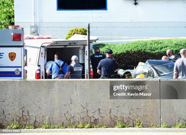 First responders work on the scene of a fatal car accident on Sunrise Highway on July 5, 2018 in West Babylon, New York. According to police, a...