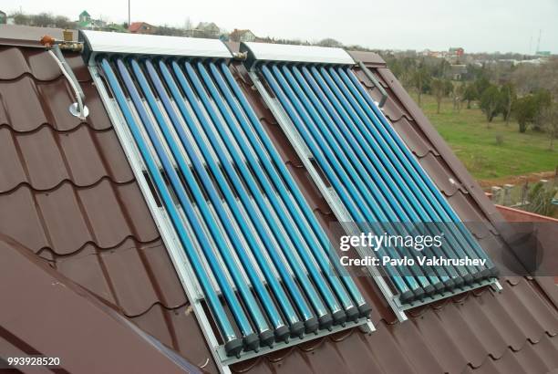 vacuum solar water heating system - solar system mobile stock pictures, royalty-free photos & images