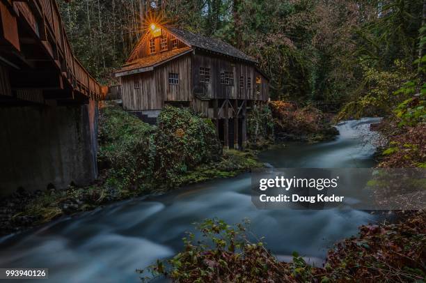 cedar creek grist mill at twilight - cedar river stock pictures, royalty-free photos & images