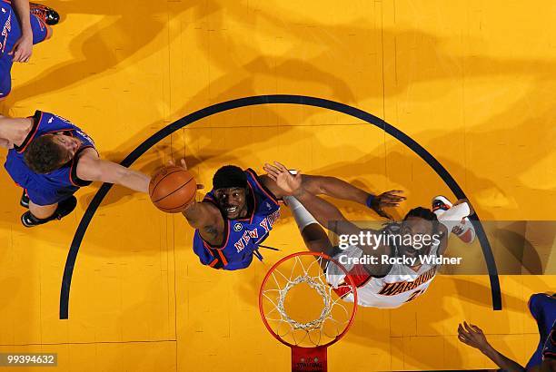 Bill Walker of the New York Knicks rebounds against Ronny Turiaf of the Golden State Warriors during the game at Oracle Arena on April 2, 2010 in...