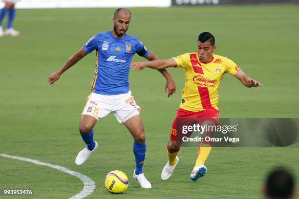 Guido Pizarro of Tigres and Aldo Rocha of Monarcas fight for the ball during a friendly match between Tigres UANL and Morelia at Toyota Stadium on...