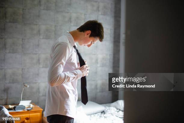 teenage boy getting dress for an event - tied up stock pictures, royalty-free photos & images