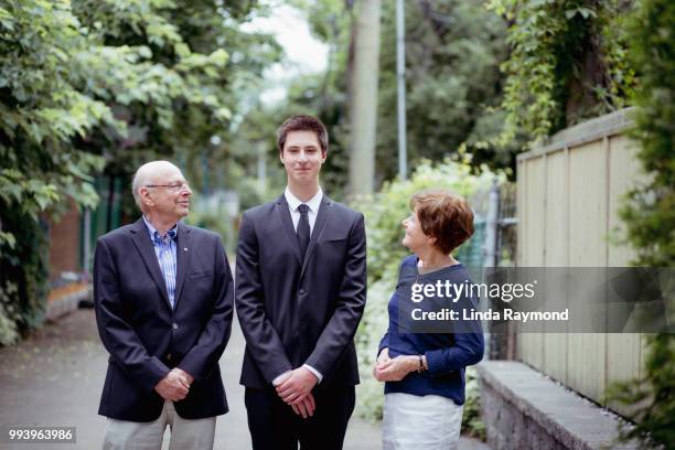 portrait of grandparents with teenage boy - boy in suit stock pictures, royalty-free photos & images