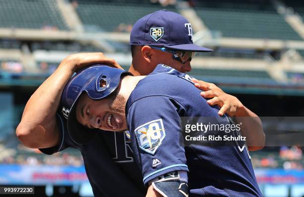 Cron of the Tampa Bay Rays is congratulated by Carlos Gomez after hitting a three run home run against the New York Mets during the first inning of a...