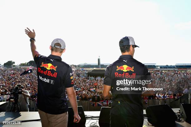 Daniel Ricciardo of Australia and Red Bull Racing and Max Verstappen of Netherlands and Red Bull Racing entertain the crowd on the fan stage after...